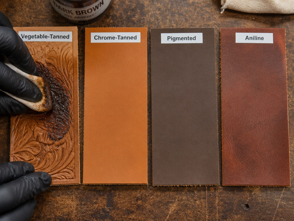 Comparing leather types for antiquing, applying gel to vegetable-tanned sample.